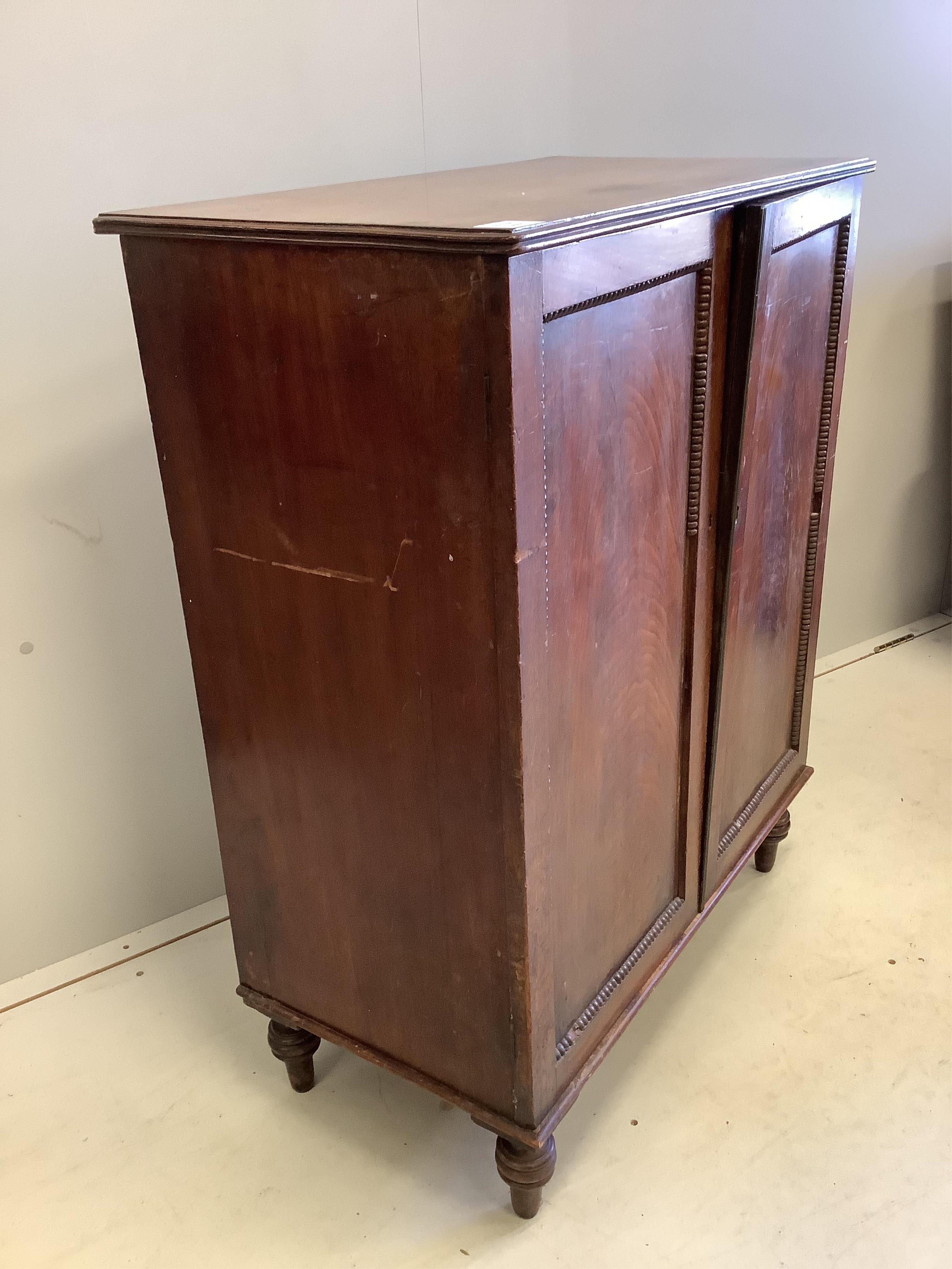 A Regency mahogany two door side cabinet, width 74cm, depth 41cm, height 95cm